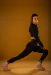 Female sports person stretching her body