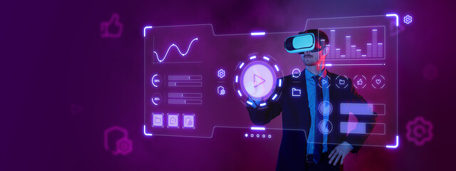Young businessman in suit wearing VR glasses on his head touch virtual screen over purple...