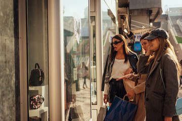 Handbags on sale. Girls shopping early in the morning