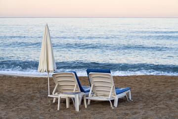 Seats at the seaside on the beach in the morning