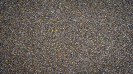 Rough grain brown black sand paper background texture