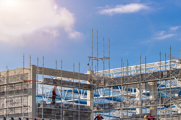 Scaffolding pipe clamp and parts,construction site with scaffold and building strength to scaffold clamps in used on construction site with sunset background,scaffolding for construction factory