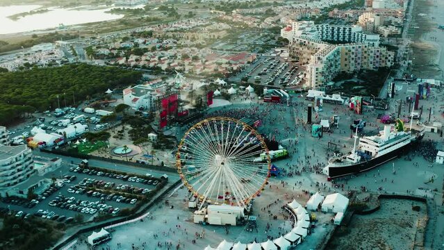 Panoramic view of a bustling beachfront event