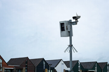 Surveillance camera that records the speed of cars and takes a picture of speeding cars where necessary