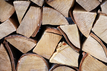 Chopped birch firewood in the woodpile. A bunch of firewood