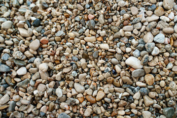 Sea stones background. Flat lay texture of sea stones.