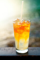 Glass of Mai Tai cocktail in front of the sea background.