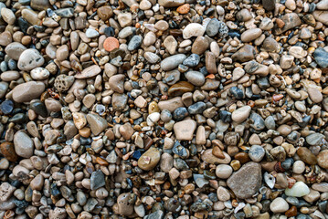 Sea stones background. Flat lay texture of sea stones.