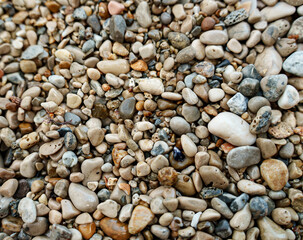 Sea stones background. Flat lay texture of sea stones.