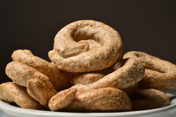 Italian taralli in a bowl. Traditional snack food of Puglia region.