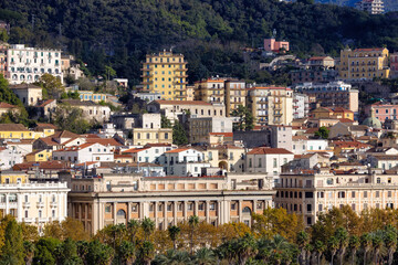 Fototapeta premium Touristic City by the Sea. Salerno, Italy. Aerial View. Cityscape and mountains background