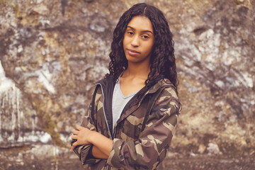 Beautiful mexican female young adult in camouflage clothing