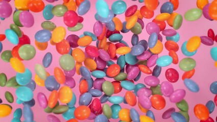 Super Slow Motion Shot of Sweet Colorful Lentils Flying and Rotating Towards Camera at 1000fps. - Powered by Adobe