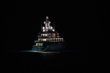 Superyacht at night moored off the coast of Sint Maarten in the Dutch Caribbean