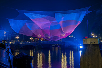 View on Amsterdam during the Light festival in the Netherlands at night.