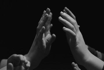 Fototapeta premium Waiting for a touch, two palms reach for each other