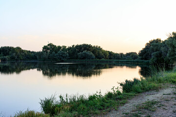 Fototapeta na wymiar lake in the forest at sunset