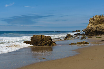 El Matador Beach along the East Pacific Coast Highway in Malibu California. The beach is a collection cliff-foot beaches and bluff top view of the eroding formations, sea stacks, caves and arches. 