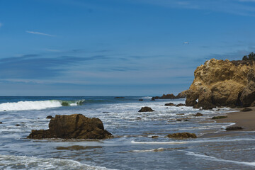 El Matador Beach along the East Pacific Coast Highway in Malibu California. The beach is a collection cliff-foot beaches and bluff top view of the eroding formations, sea stacks, caves and arches. 