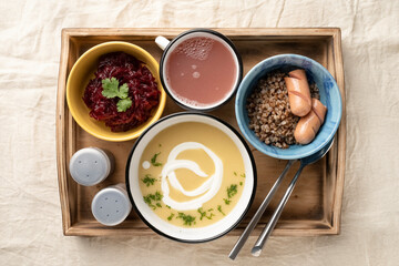 Set lunch in bowls in a wooden serving box. Food and catering concept. Open container for food