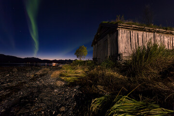 Aurora and old cabin