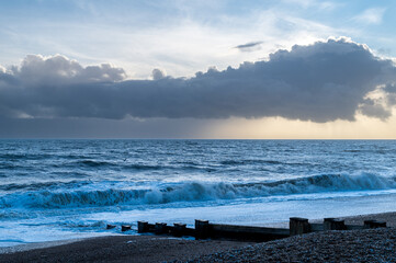 Dramatic clouds over the sea and beach at Bexhill-on-Sea, UK