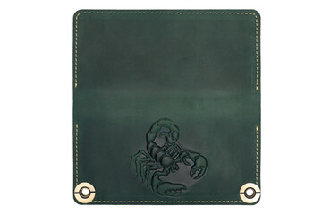 Big green leather wallet on a button on a white background, scorpion print. Top view