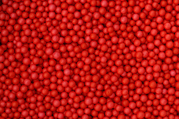 Red foam beads background. Valentine day