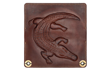 Big brown leather wallet on a button on a white background, crocodile print. Top view
