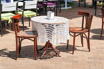 Street Cafe. Street restaurant table. Table with tablecloth and chairs