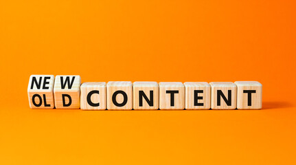 New or old content symbol. Concept words New content and Old content on wooden cubes. Beautiful orange table orange background. Business New or old content concept. Copy space.