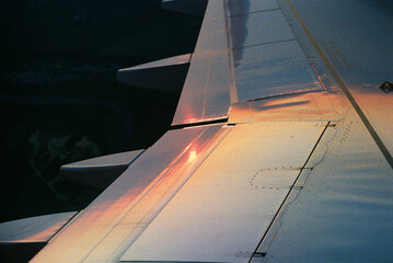 Airplane wing at sunset