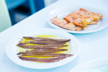 Cantabrian anchovies served with olive oil. Traditional northern Spanish tapa recipe.