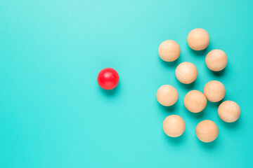Abstract different red ball is free from the group of common wood balls, business, and marketing concept, niche, individual, potential person