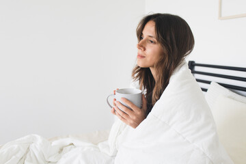 Woman Holding Mug in Bed Cozy and Comfortable