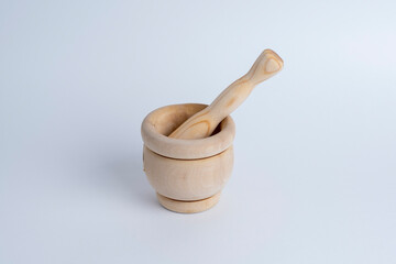 wooden mortar and pestle isolated on white background