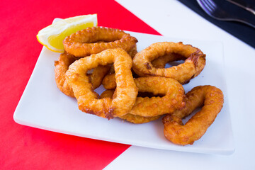 Roman squid rings. Battered squid, traditional Spanish tapa recipe.