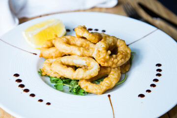 Roman squid rings. Battered squid, traditional Spanish tapa recipe.