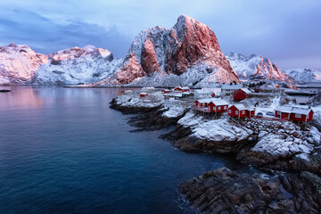 Winter landscape: Morning light on fjord with red houses, Lofoten islands, Norway