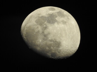 Telescopic view of a full moon. Full moon shot showing details of the moon s surface.
