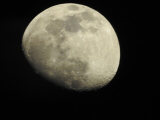 Telescopic view of a full moon. Full moon shot showing details of the moon s surface.