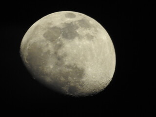 Telescopic view of a full moon. Full moon shot showing details of the moon s surface.