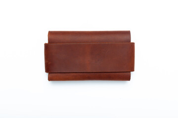 Small brown leather wallet on a buttons on a white background. Top view
