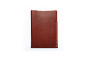Brown leather wallet on a button on a white background. Card holder. Top view