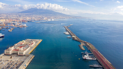Aerial view of the port of Naples, Italy. In the background the Vesuvius volcano which dominates...