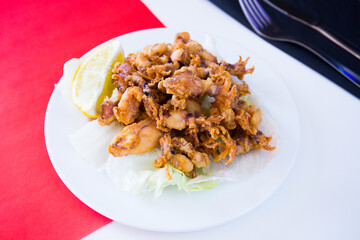 Chipirones Fritos. Deep fried Baby Squid. Traditional Spanish tapa recipe.