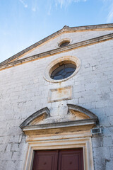 Catholic church of St Anastasia built in 18th century, front with entrance, in small town Biograd na Moru in Croatia