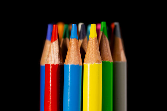 Colored pencils on black background