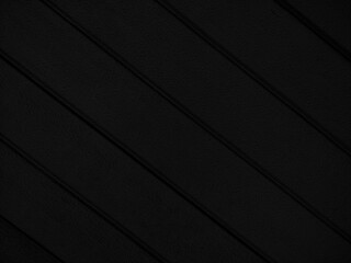 Dark black texture with diagonal lines. Black wall background