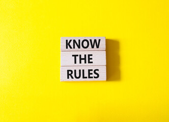 Know the rules symbol. Wooden blocks with words Know the rules. Beautiful yellow background. Business and Know the rules concept. Copy space.